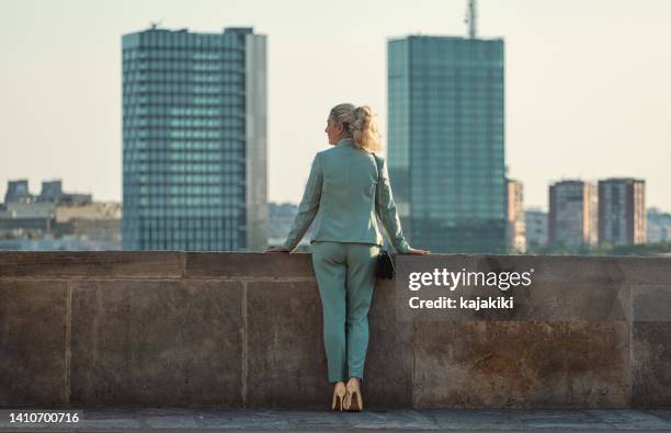portrait of businesswoman outdoors - high heel stockfoto's en -beelden