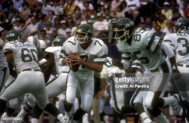 Quarterback Ken O'Brien of the New York Jets drops back to pass in the game between the Miami Dolphins vs New York Jets at The Meadowlands on...