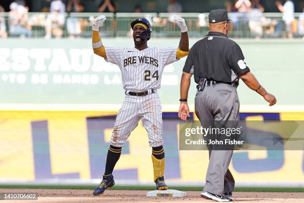 Andrew McCutchen of the Milwaukee Brewers reacts after hitting a two run double to give the Brewers the lead in the eighth inning against the...