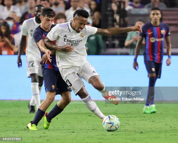 Pedro "Pedri" González of Barcelona and Éder Militão of Real Madrid vie for the ball during their preseason friendly match at Allegiant Stadium on...