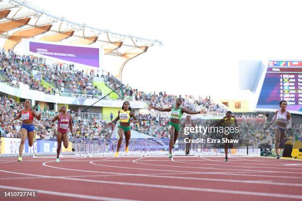 Tobi Amusan of Team Nigeria crosses the finish line to win gold in the Women's 100m Hurdles Final on day ten of the World Athletics Championships...