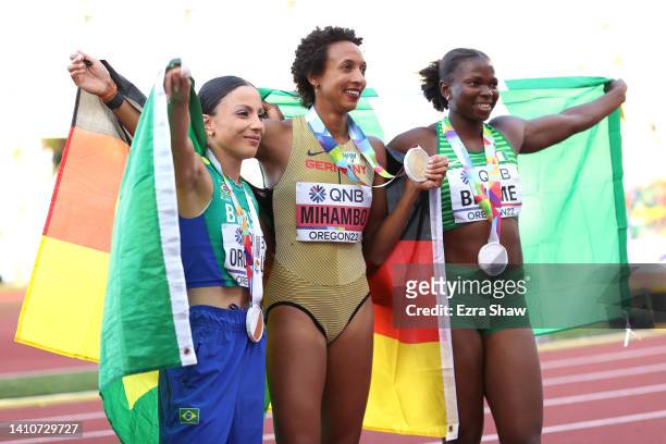 Bronze medalist Leticia Oro Melo of Team Brazil, gold medalist Malaika Mihambo of Team Germany, and silver medalist Ese Brume of Team Nigeria...