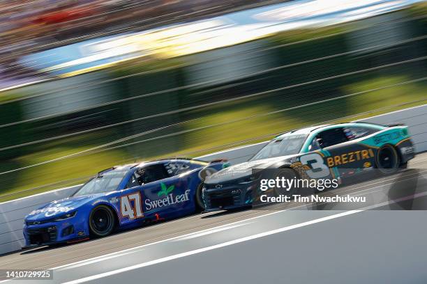 Ricky Stenhouse Jr., driver of the Kroger/SweetLeaf Chevrolet, and Austin Dillon, driver of the BREZTRI Chevrolet, race during the NASCAR Cup Series...