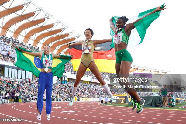 Bronze medalist Leticia Oro Melo of Team Brazil, gold medalist Malaika Mihambo of Team Germany, and silver medalist Ese Brume of Team Nigeria...