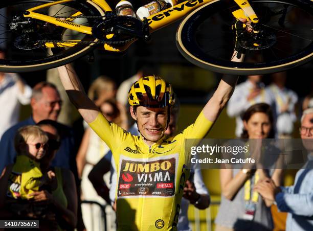 Jonas Vingegaard of Denmark and Jumbo - Visma celebrates winning the race leader's yellow jersey after crossing the finish line of ultimate stage 21...