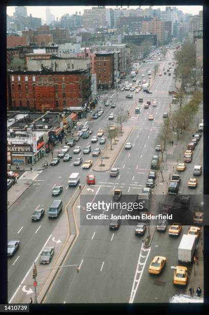 Traffic moves along Houston Street in the East Village June 1, 1998 in New York City. Populated by residents of numerous heritages including Jewish,...