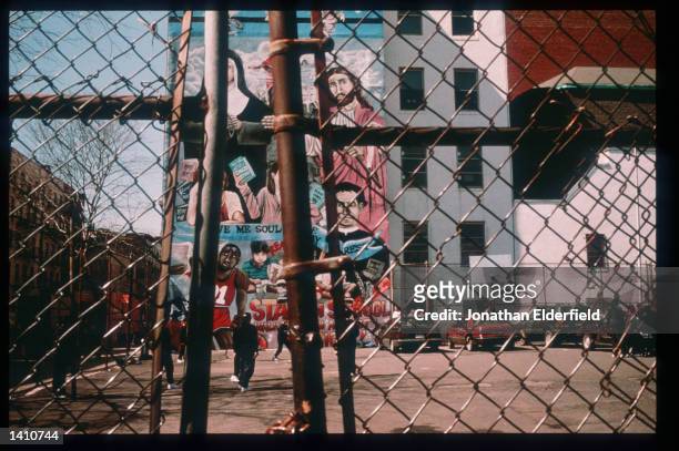 School mural is on display at the corner of 11th Street and Avenue A in the East Village June 1, 1998 in New York City. Populated by residents of...