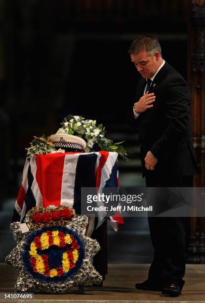 Darren Rathband, the twin brother of PC David Rathband, stands by his coffin during a memorial service inside St Nicholas Cathedral on March 10, 2012...