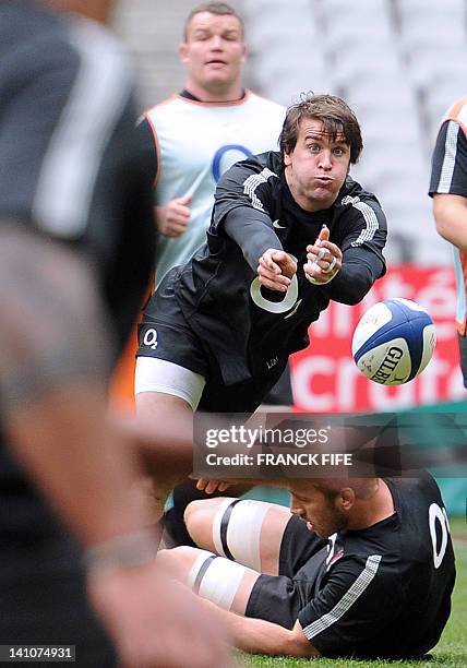 England's scrum-half Lee Dickson passes the ball during a training session at the Stade de France in Saint-Denis, north of Paris, on the eve of their...