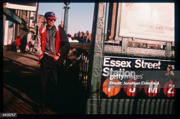 Man walks near the subway entrance on Delancey Street in the East Village June 1, 1998 in New York City. Populated by residents of numerous heritages...