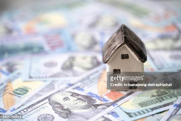 home model with dollar,home loan rate,home insurance concept, - house price imagens e fotografias de stock
