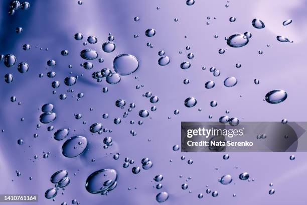 close up macro aloe vera gel serum cosmetic texture lilac background with bubbles. - retinol stock pictures, royalty-free photos & images