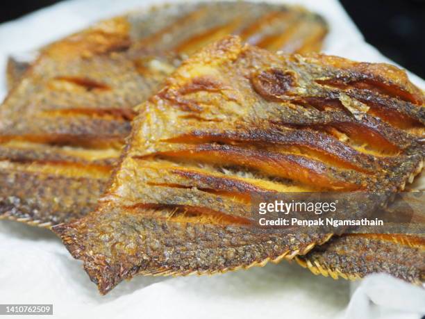 fried sun dried fish - cook battered fish stock pictures, royalty-free photos & images