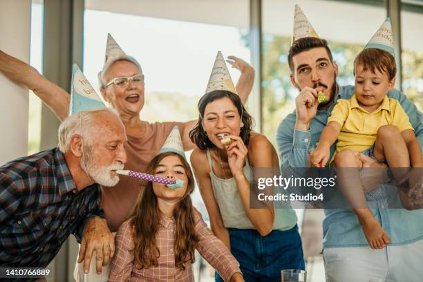 family reunion for little girl's birthday - congratulating child stock pictures, royalty-free photos & images