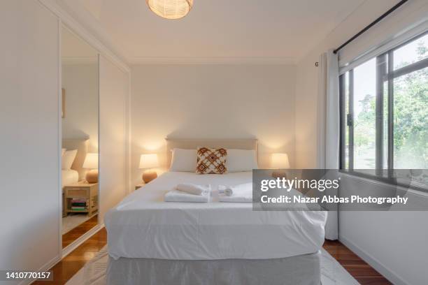 spacious bedroom with attached washroom. - kondo photography stock pictures, royalty-free photos & images