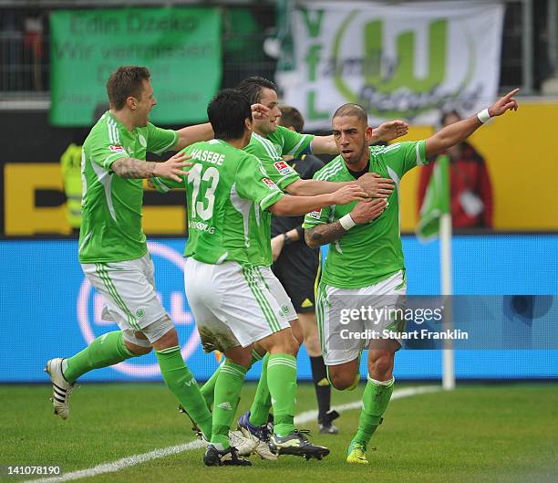 Ashkan Dejagah of Wolfsburg celebrates scoring his goal with teamates during the Bundesliga match between VfL Wolfsburg and Bayer 04 Leverkusen at...