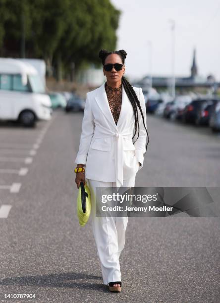 Barbara Becker wearing a white Riani suit and attends the Riani Fashion Festival on July 23, 2022 in Dusseldorf, Germany.