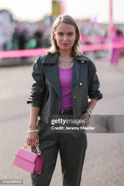 Caro Cult wearing a matching olive jacket and pants and Riani rose bag and rose heels from Riani and attends the Riani Fashion Festival on July 23,...