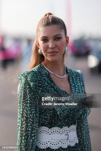 Paulina Swarovski wearing a green mini dress from Riani and attends the Riani Fashion Festival on July 23, 2022 in Dusseldorf, Germany.