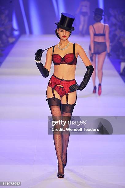 Model showcases a design by Von Follies by Dita Von Teese during the Von Follies show on day three of the 2012 L'Oreal Melbourne Fashion Festival on...