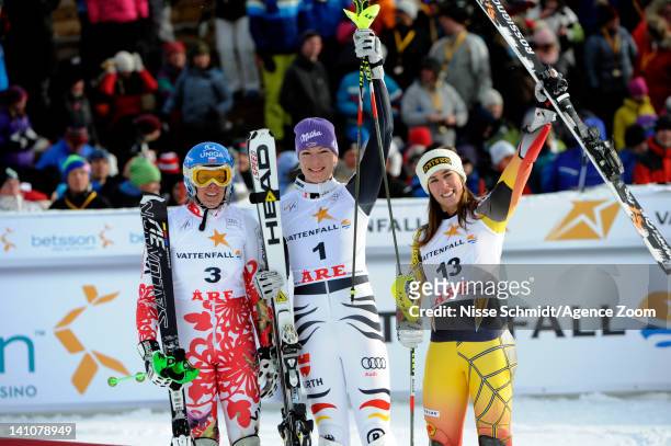 Maria Hoefl-Riesch of Germany takes 1st place, Veronika Zuzulova of Slovakia takes 2nd place, Marie-Michele Gagnon of Canada takes 3rd place during...