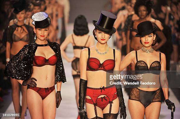 Models showcase designs by Von Follies by Dita Von Teese during the Von Follies show on day three of the 2012 L'Oreal Melbourne Fashion Festival on...
