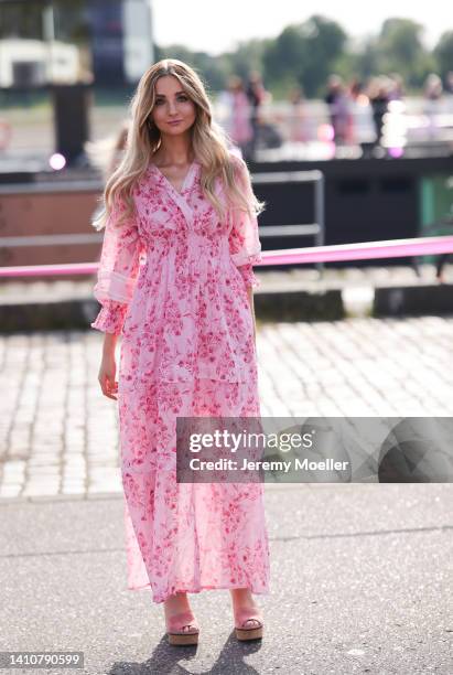 Anna Hiltrop wearing a rose maxi dress from Riani and attends the Riani Fashion Festival on July 23, 2022 in Dusseldorf, Germany.
