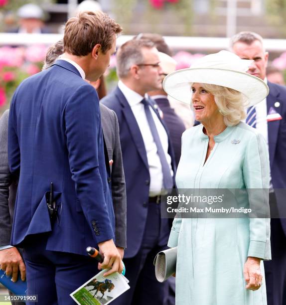 Camilla, Duchess of Cornwall talks with ITV Racing presenter Oli Bell as she attends the QIPCO King George Diamond Day, where she presented the...