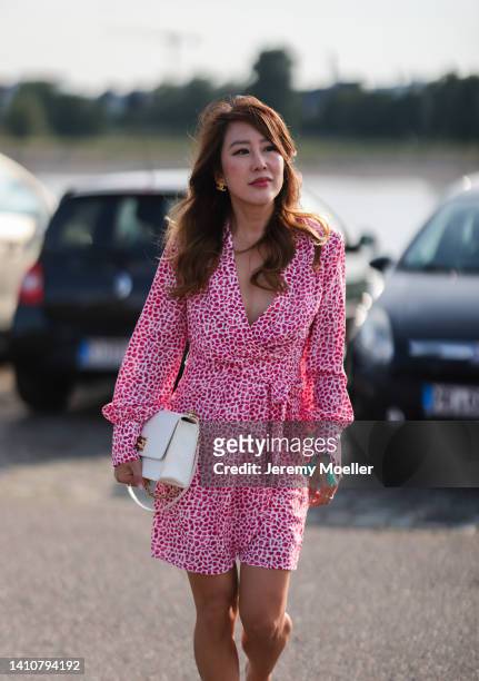 Ji Kim wearing a Riani mini dress in pink and attends the Riani Fashion Festival on July 23, 2022 in Dusseldorf, Germany.