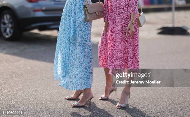 Patricia Wirschke and Ira Meindl wearing both Riani dresses and attends the Riani Fashion Festival on July 23, 2022 in Dusseldorf, Germany.