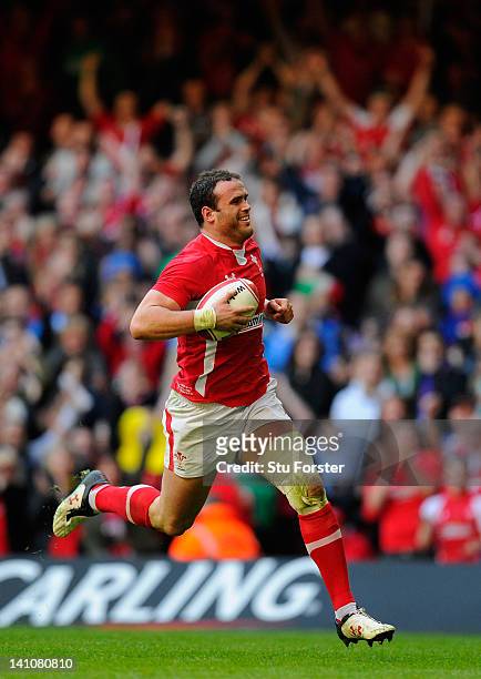 Wales centre Jamie Roberts scores his try during the RBS Six Nations match between Wales and Italy at the Millennium stadium on March 10, 2012 in...