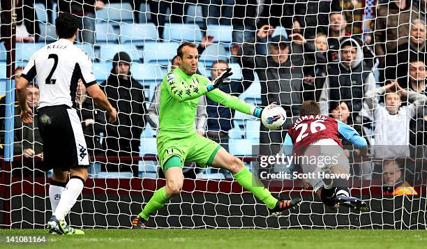 Andreas Weimann of Aston Villa scors their winning goal past Mark Schwarzer of Fulham during the Barclays Premier League match between Aston Villa...