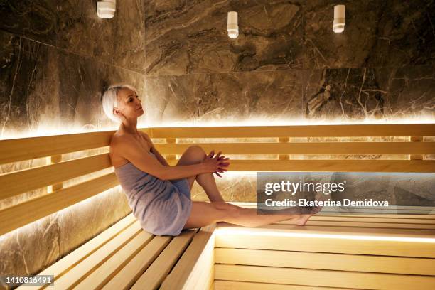 senior woman resting in sauna - senior full body isolated stock pictures, royalty-free photos & images