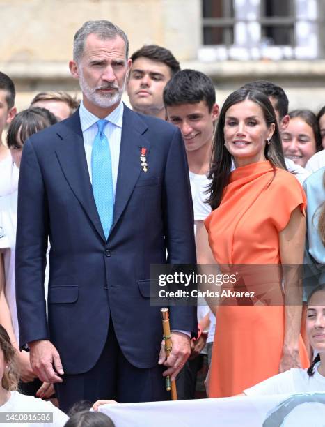 King Felipe VI of Spain and Queen Letizia of Spain pose with guests as they depart the national offering to the apostle Santiago during the regional...