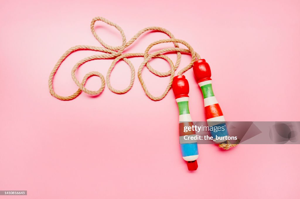 Jump rope on pink background