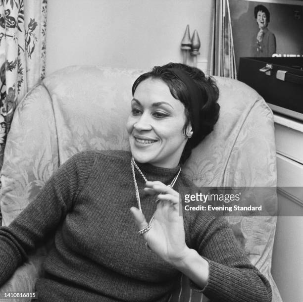American actress and singer Chita Rivera, wearing a turtleneck sweater and playing with her necklace, in London, England, 6th February 1962. Rivera...
