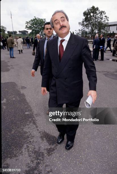 Italian magistrate Giovanni Falcone while walking. Rome , 1990s.