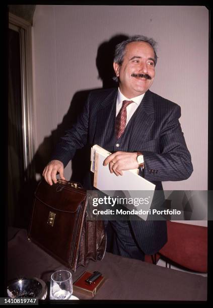 Italian magistrate Giovanni Falcone smiling. Rome , 1990s.