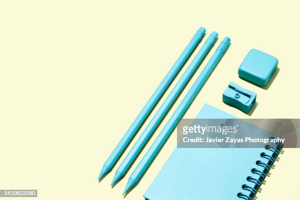 arrangement of blue stationery on yellow background - pencil with rubber stock pictures, royalty-free photos & images