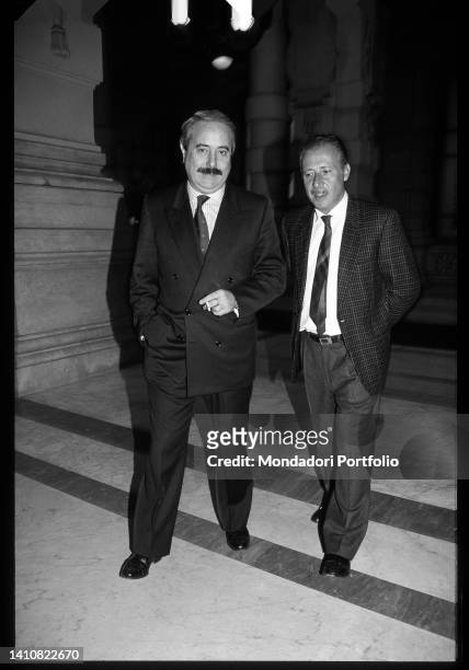 Italian magistrates Giovanni Falcone and Paolo Borsellino during a break at the Palace of Justice. Rome , 1990s