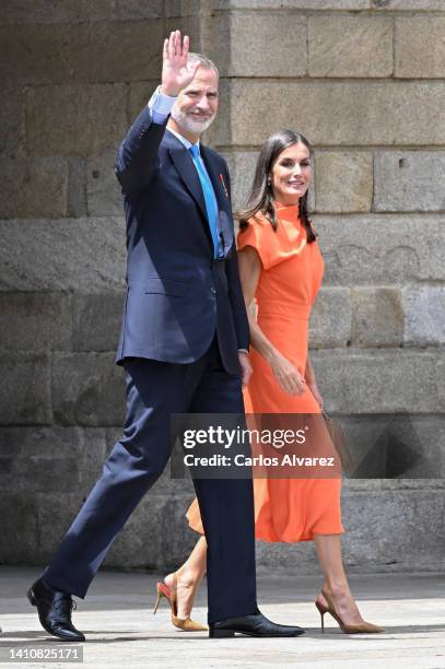 King Felipe VI of Spain and Queen Letizia of Spain wave as they depart the national offering to the apostle Santiago during the regional festivity at...