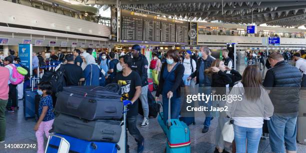 passengers at the departure area of frankfurt international airport - crowded airport stock pictures, royalty-free photos & images