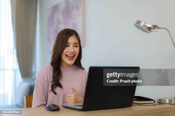 asian business woman talking to her colleagues about plan in video conference. multiethnic business team using computer for a online meeting in video call. - business plan covid stock pictures, royalty-free photos & images