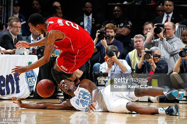 Lorenzo Brown of the North Carolina State Wolfpack steals the ball from Harrison Barnes of the North Carolina Tar Heels during the semifinals of the...