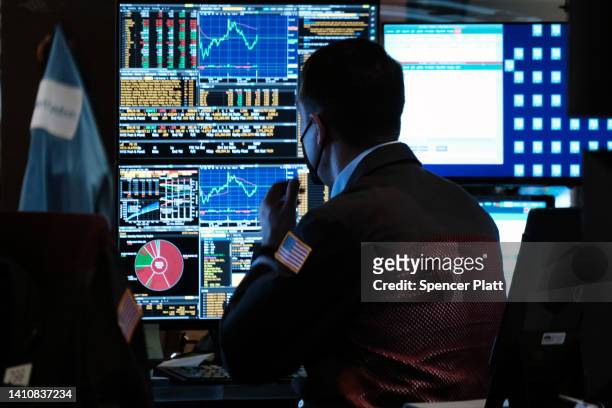 Traders work on the floor of the New York Stock Exchange on July 25, 2022 in New York City. Stocks rose slightly in morning trading as investors...