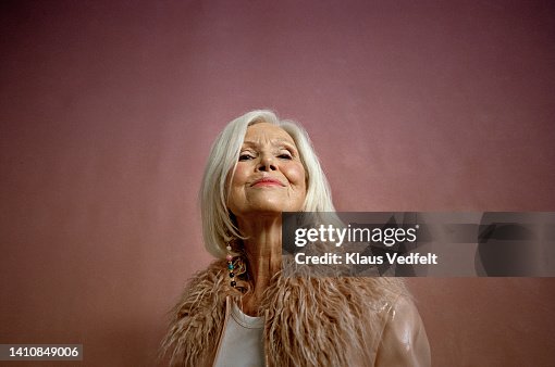 Portrait of confident senior woman in fur jacket Portrait of confident senior woman in fur jacket