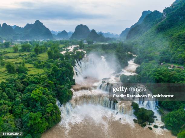 aerial drone sunset scene of ban gioc detian waterfall at the border of china and vietnam - detian waterfall stock pictures, royalty-free photos & images
