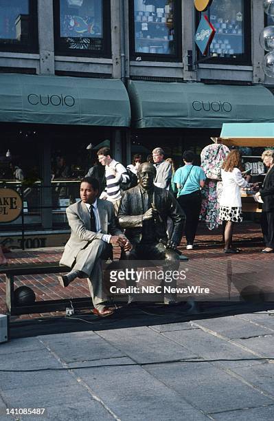 Visits US Vacation Spots: Boston 1990" -- Pictured: NBC News' Bryant Gumbel sitting with the Arnold "Red" Auerbach statue at Faneuil Hall on May 14,...