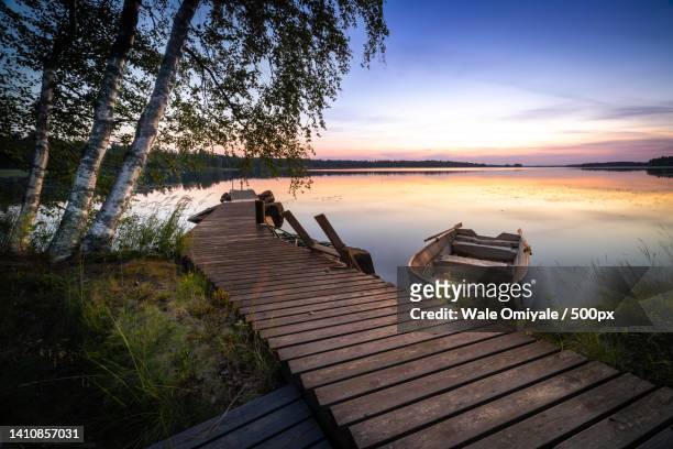scenic view of lake against sky during sunset,kangasniemi,finland - lake finland bildbanksfoton och bilder