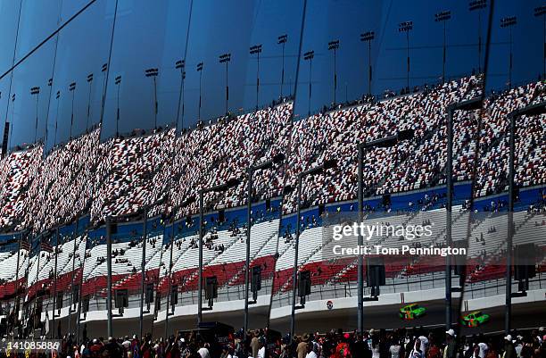 The reflection of Danica Patrick, driver of the GoDaddy.com Chevrolet, on track qualifying for the NASCAR Nationwide Series Sam's Town 300 at Las...